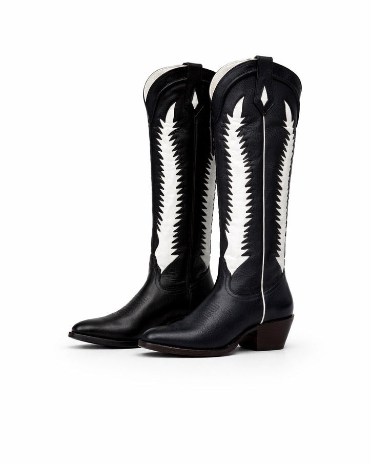 Black cowboy boots with white patterns on a white background