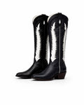Black cowboy boots with white patterns on a white background